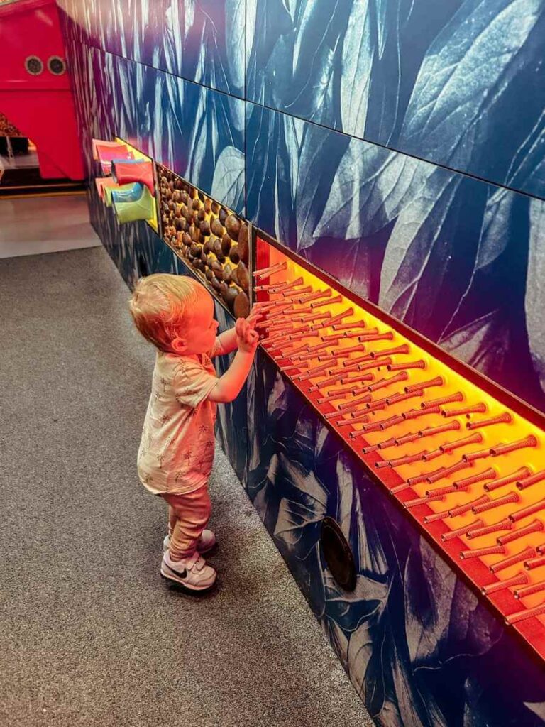 Sensory music wall for toddlers in The Garden at the Science Museum London, designed for hands-on play.
