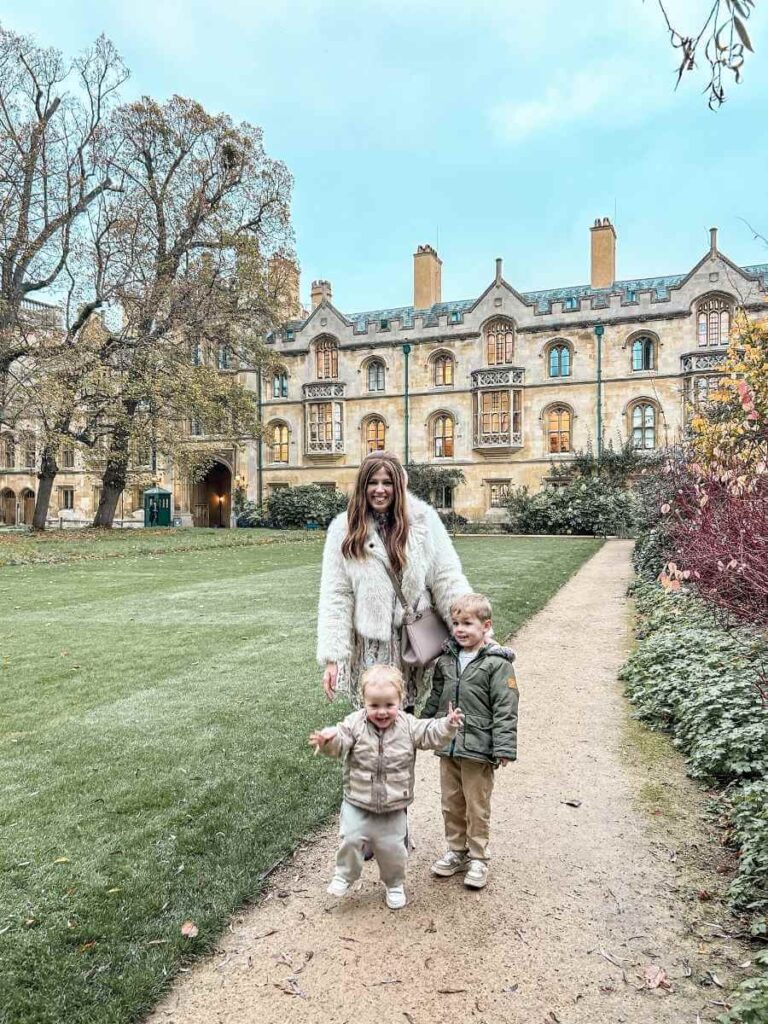 Mum in the City with her kids in the historic grounds of Trinity College – a beautiful spot to visit in Cambridge with children.