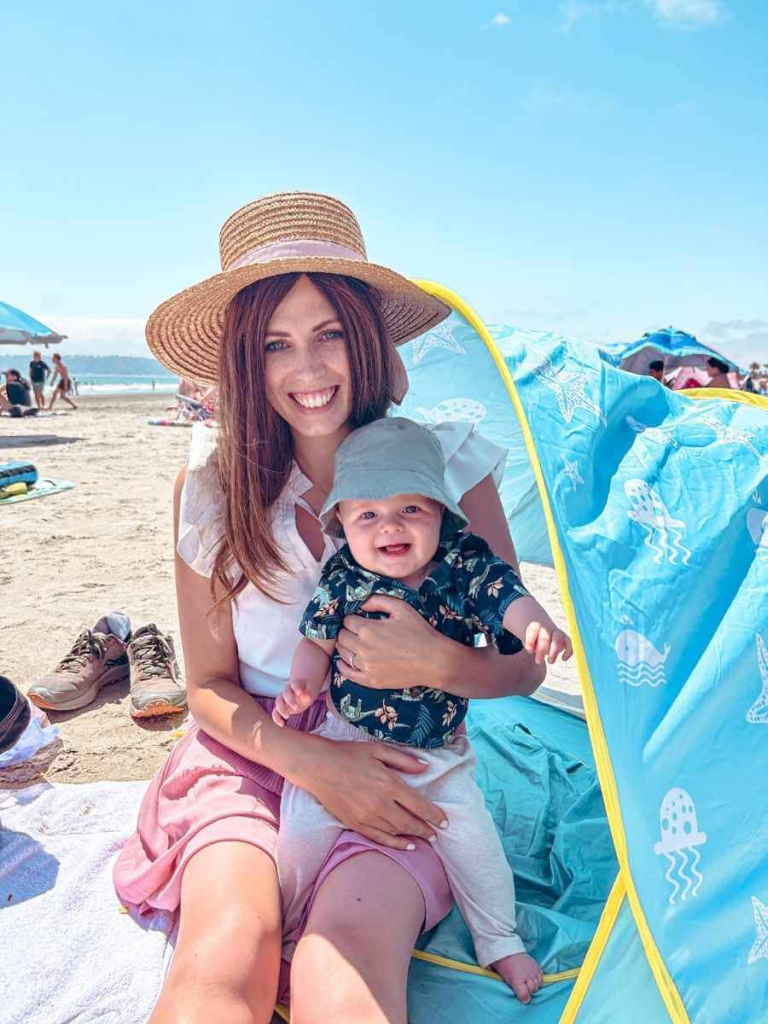 Mum and baby enjoying the sandy beach on Coronado Island, a family-friendly San Diego destination