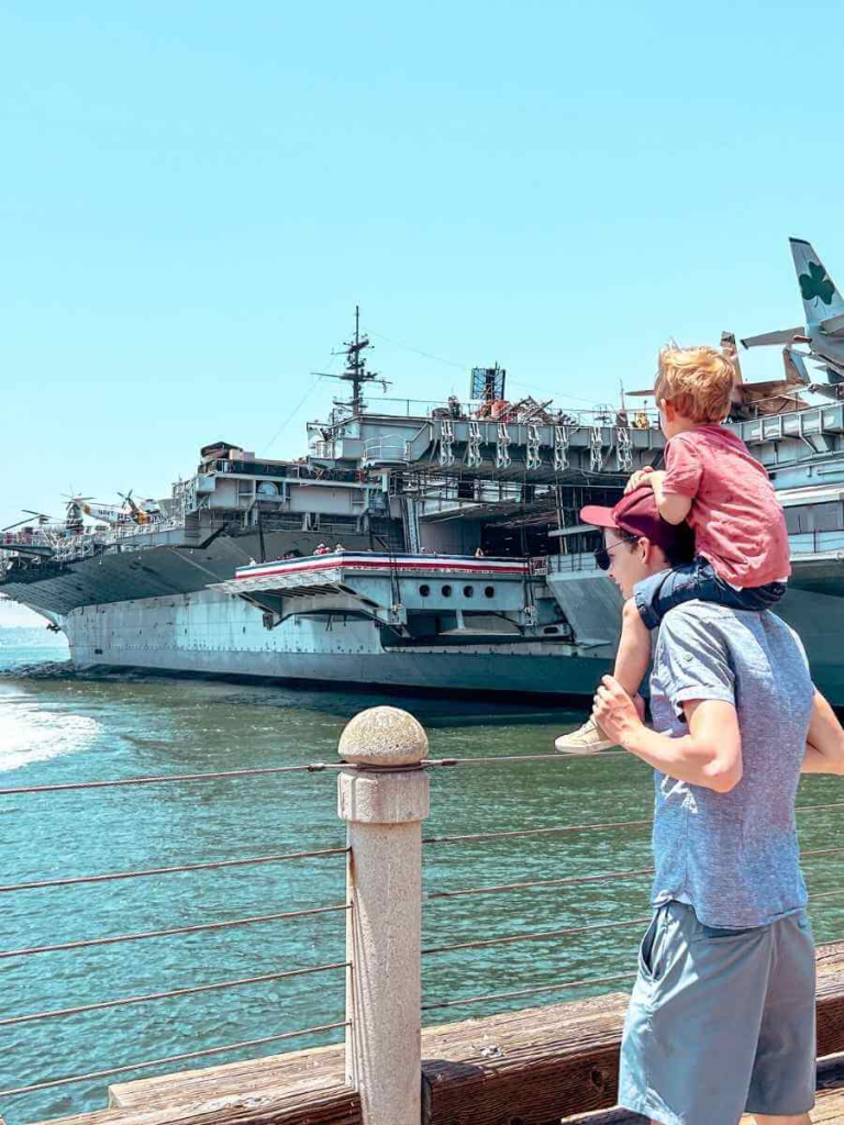 Father and Son admiring the USS Midway Museum, one of the top attractions in San Diego for kids