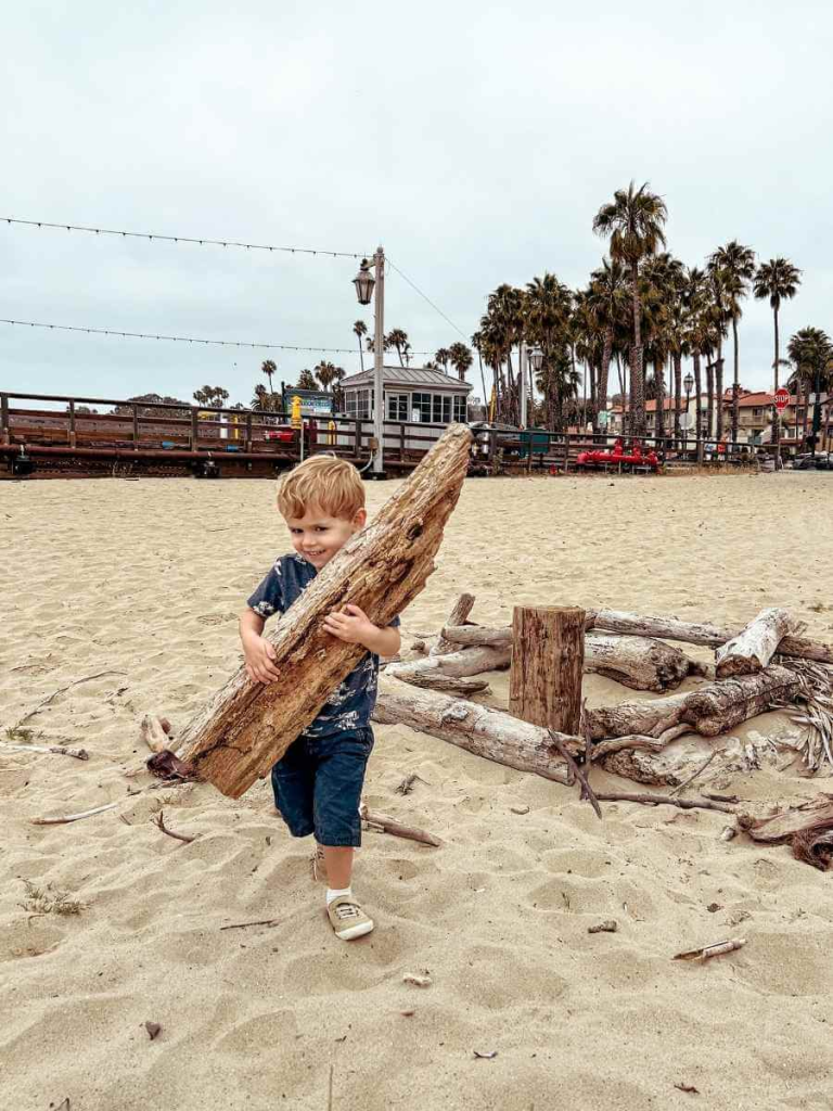 Toddler enjoying East Beach, one o the best things to do in Santa Barbara with kids.