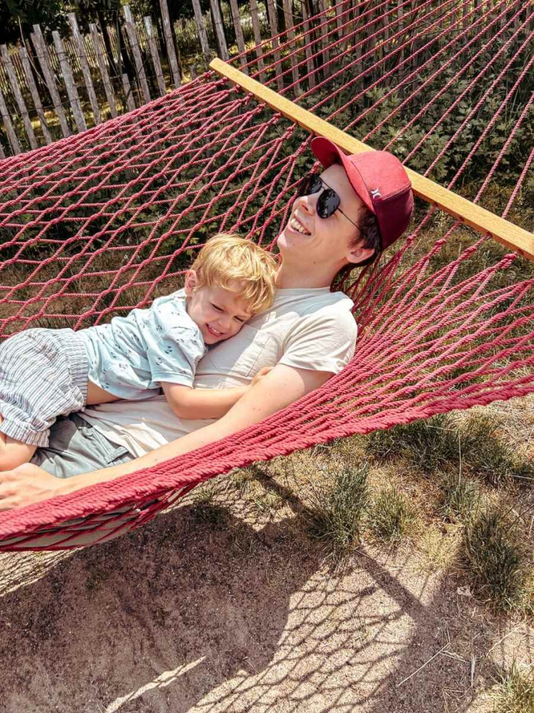 elaxing in a hammock at Hammock Grove – a peaceful and fun family activity on Governors Island NYC.