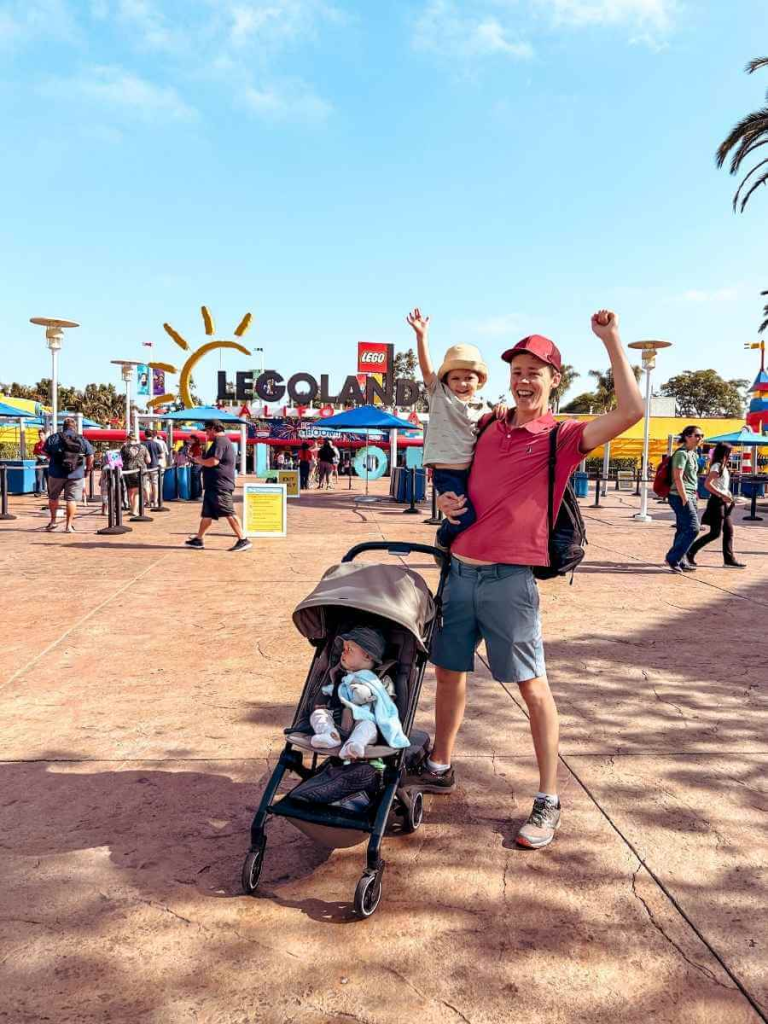 Family photo outside the gates of LEGOLAND California, a must do with kids!