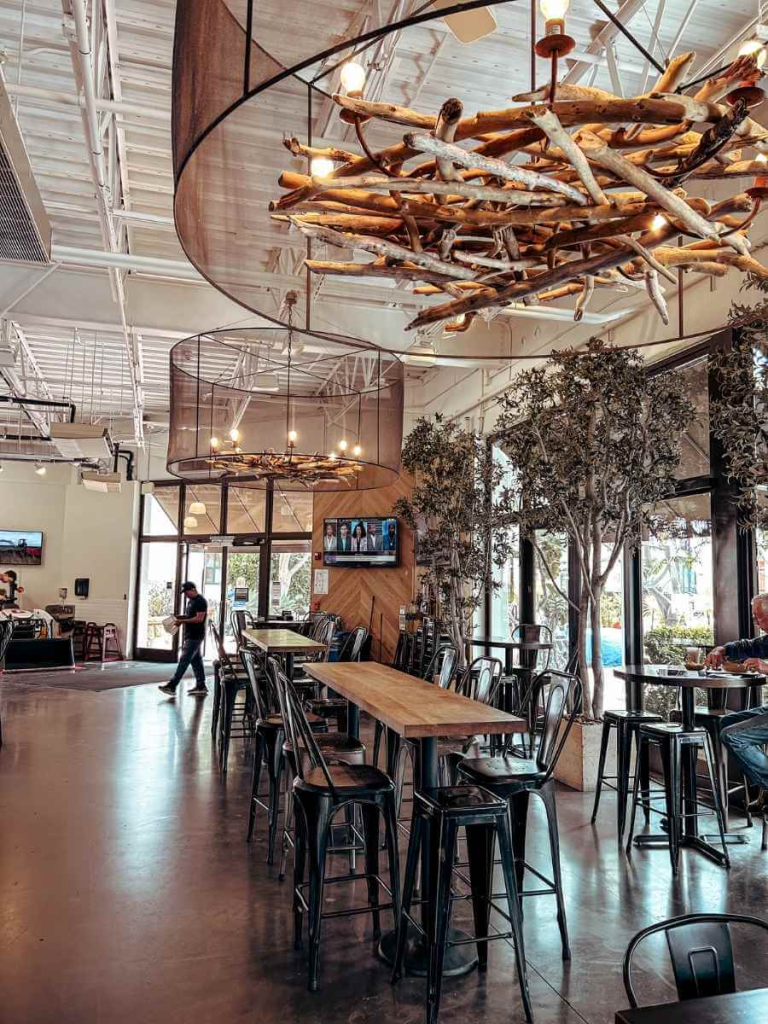 Inside Santa Barbara Public Market, with food stalls, communal seating, and a vibrant, family-friendly atmosphere.