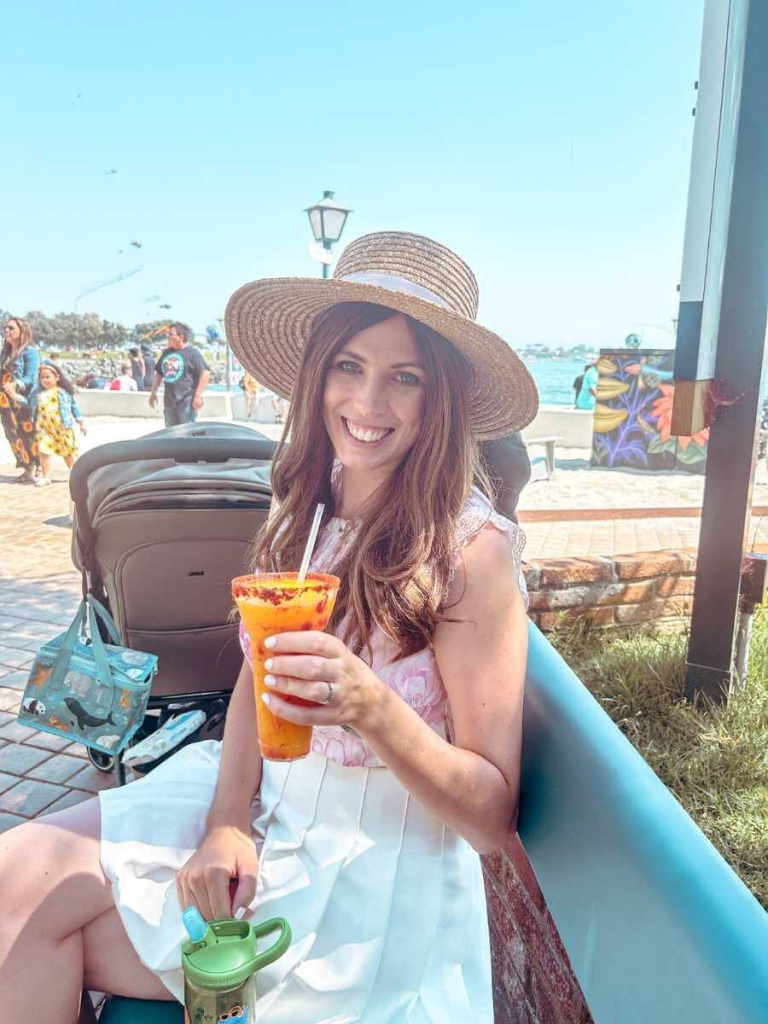 Enjoying a frozen margarita at Seaport Village, a relaxing spot for parents on a family trip to San Diego