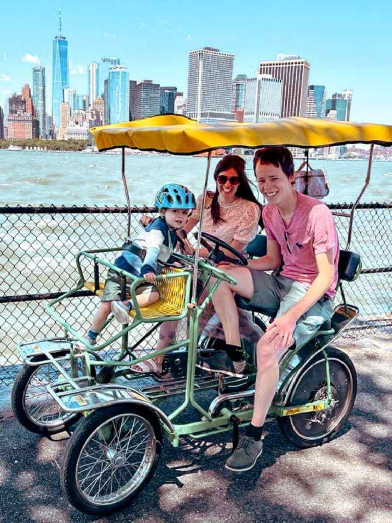 Riding a surrey bike around Governors Island – one of the best family-friendly things to do on Governors Island.
