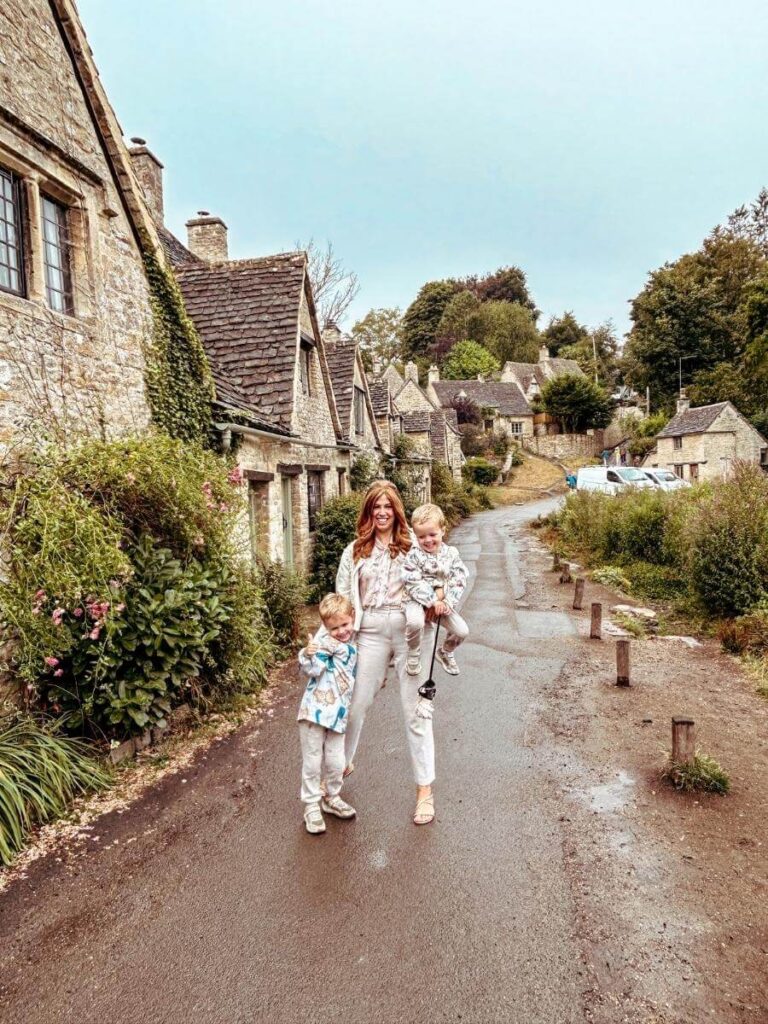 A family photo on Arlington Row, one of the most beautiful streets to visit in the Cotswolds.