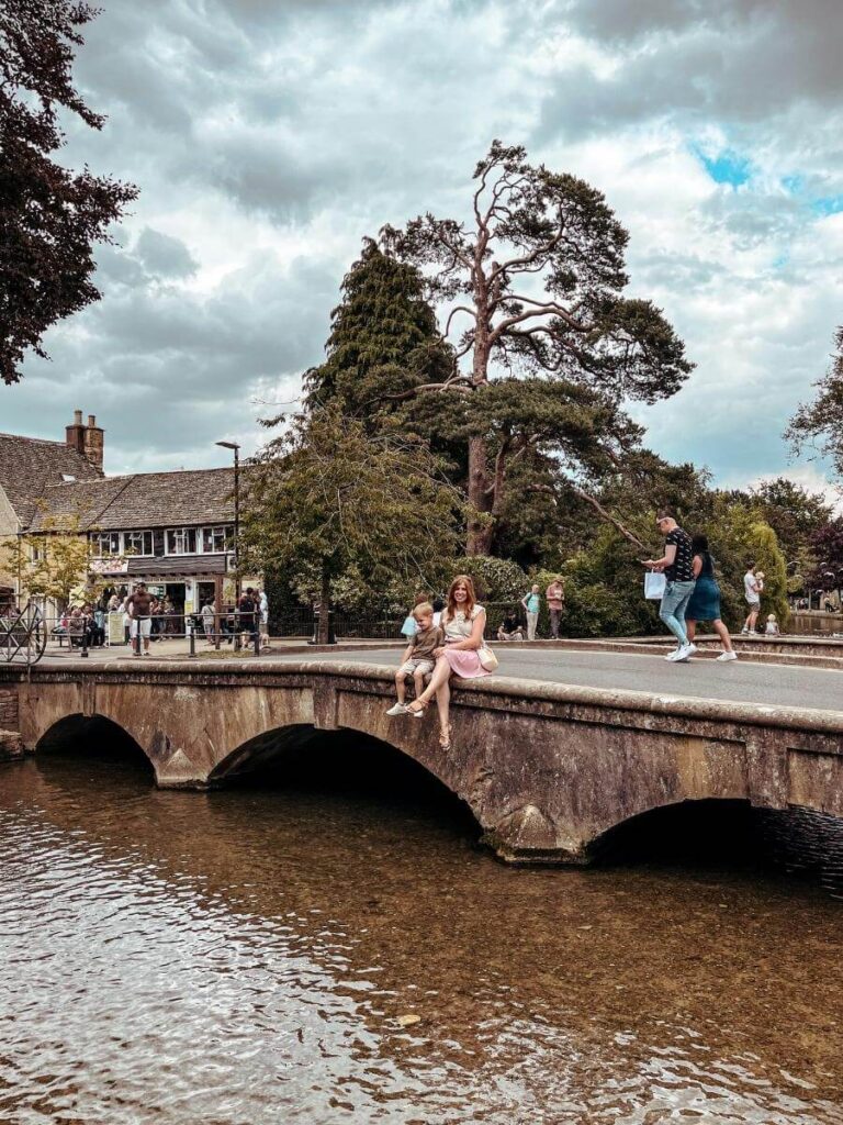 View of one of the canals in Bourton-on-the-Water. An iconic, town to visit on a 2 day Cotswolds itinerary.