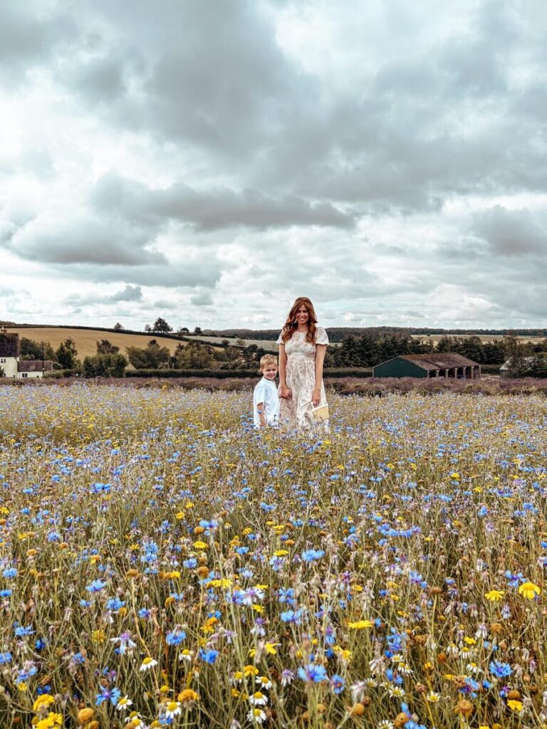 Playing in the wildflower meadow at Cotswolds Lavender, a perfect spot for things to do in the Cotswolds with kids