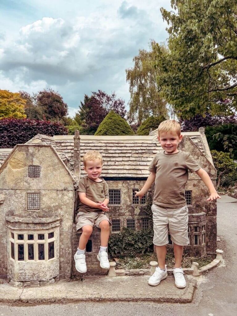 Children exploring the Cotswolds model village, a fun thing to do in the Cotswolds with kids