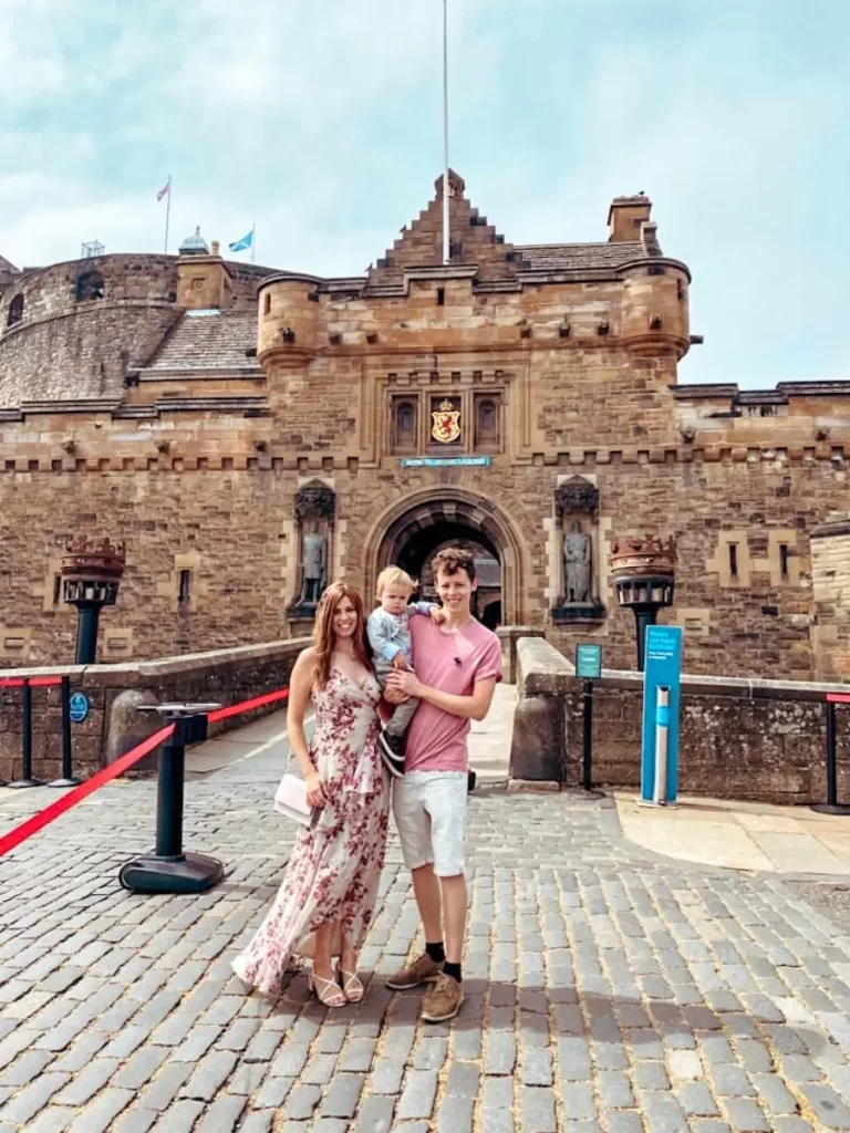 Family Outside Edinburgh Castle on a trip to Edinburgh with kids.