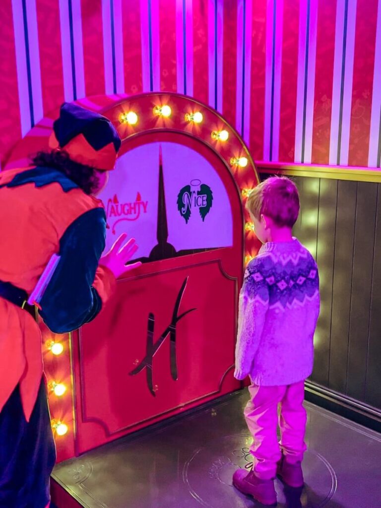 Checking to see if we are naughty or nice on the machine in Santas Grotto.