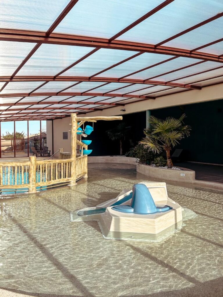 The indoor children's pool with water slide and feature is perfect for toddlers.