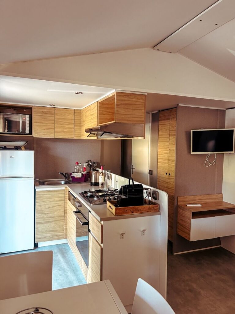 The kitchen area inside the mobile homes at Yelloh! Domaine de Drancourt.