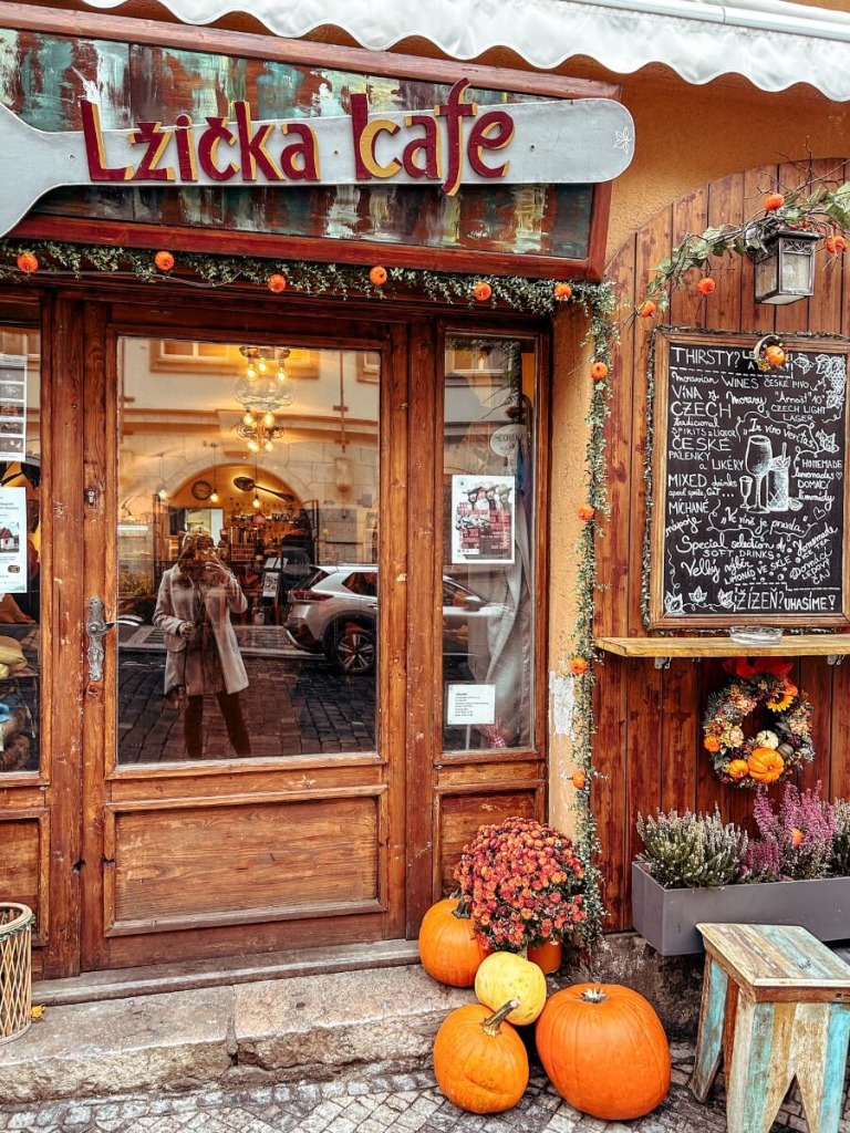 The outside of Lžička Café in Prague decorated for autumn / fall. 
