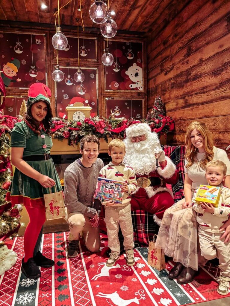 Mumm in the City and her family meeting with Santa at the Hilton London Bankside.