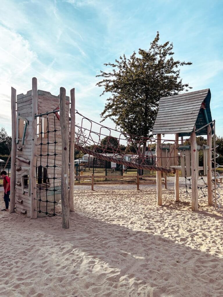 Play equipment in the sandy playground, perfect for children up to age 12.