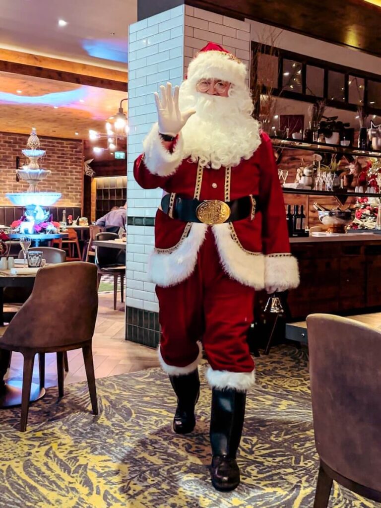 SFather Christmas greeting children during the OXBO Brunch. A fun detail as part of our HIlton London Bankside Review.