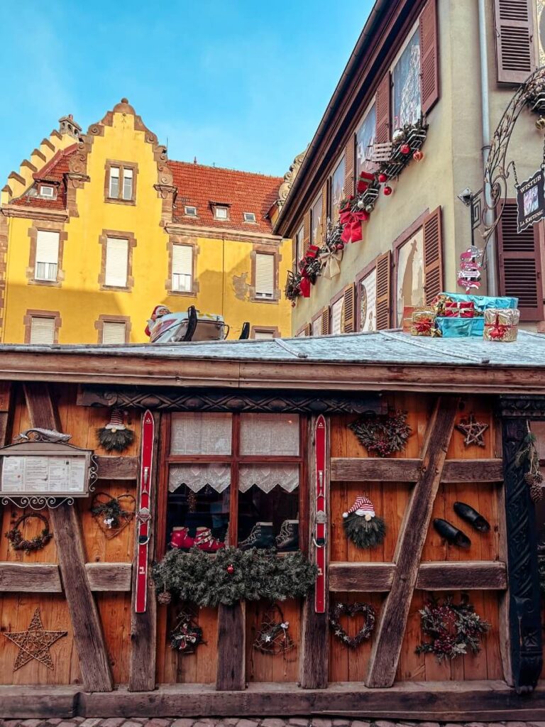 A restaurant in Colmar with festive decorations outside.