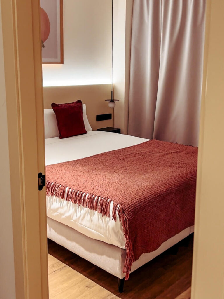 Bedroom at the Magno Apartments in Seville, Spain
