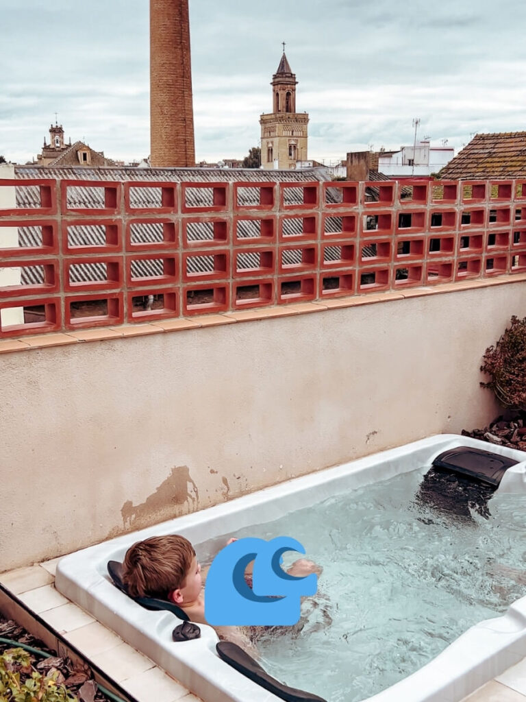 Enjoying the Rooftop Spa at Magno Apartments Seville, a great family friendly apartment.