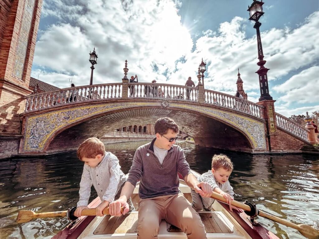 Rowing boats on the canal at Plaza de España. A fun thing to do with kids in Seville. 