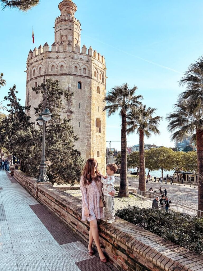 Alex Mills, Mum in the City and her son outside Torre del Oro. A fun things to do in Seville with kids.