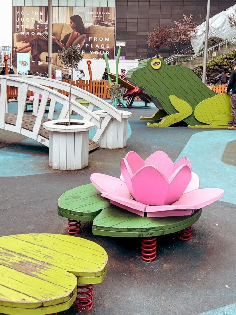The colourful Biodiversity Playground in Stratford with cute frog and lily pad theme.