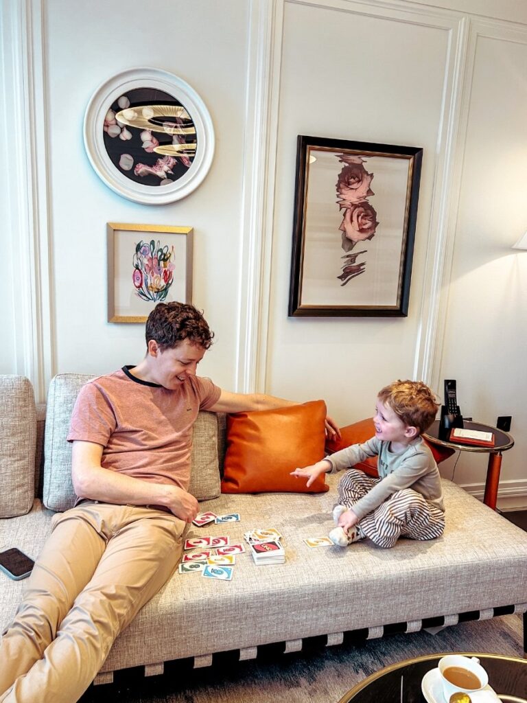 Father and son playing games in the luxury suite at Park Hyatt London River Thames