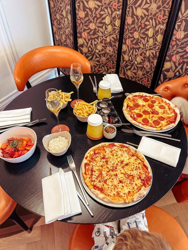 Family pizzas form the room service menu at Park Hyatt London River Thames