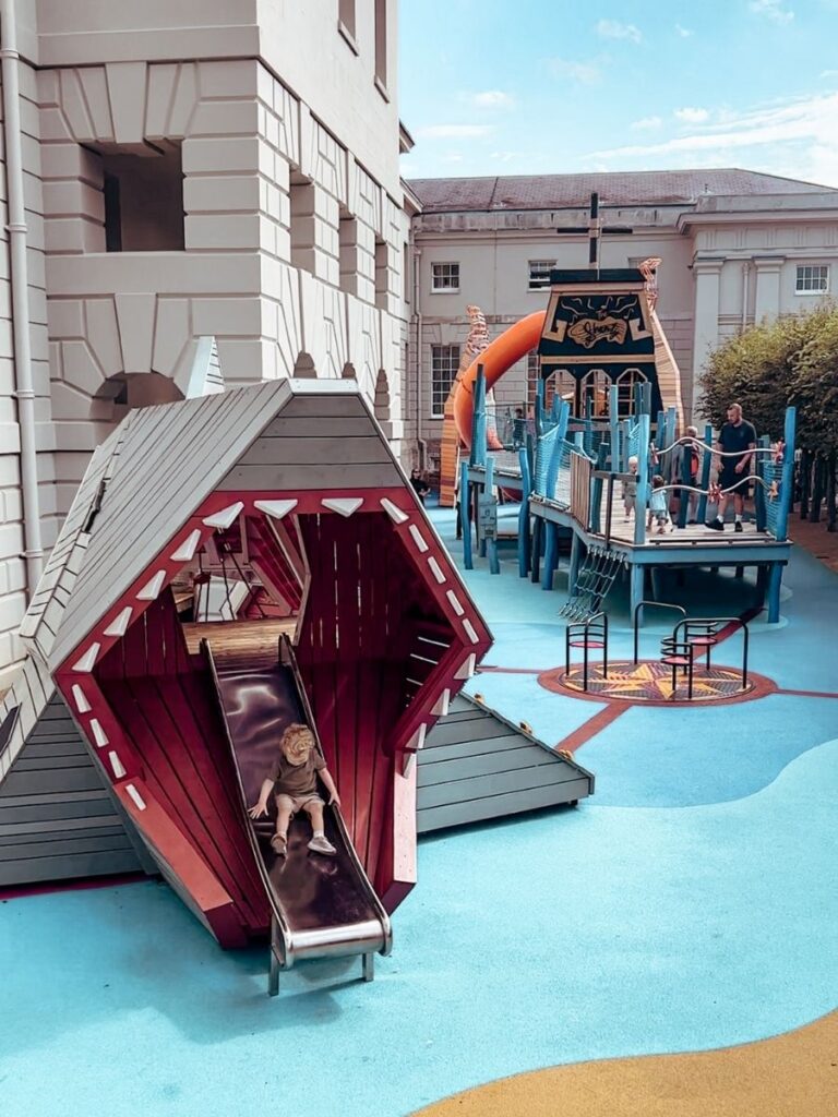 View of kids playing in The Cove Playground, Greenwich, London