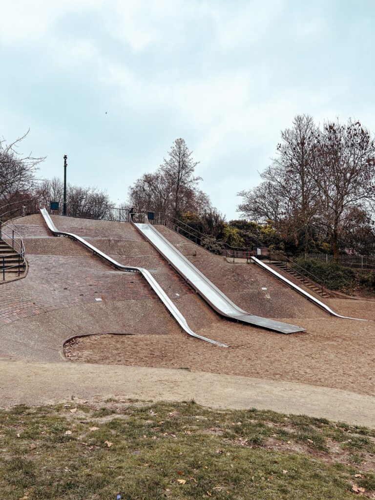 Long slides in Victoria Park Playground, East London. 