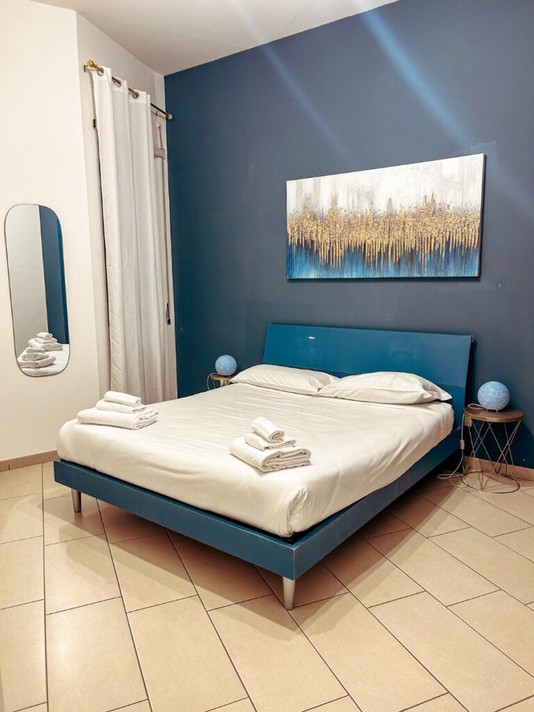 Bedroom in Angioino Apartments in Naples, a great place for families to stay.