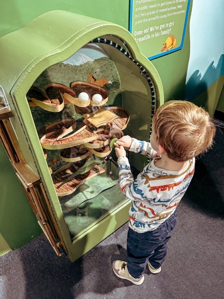 Toddler having fun playing in the Children's Museum of Manhattan.