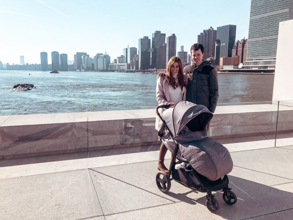 Mum and Dad enjoying the NYC skyline while their toddler naps in the stroller. 