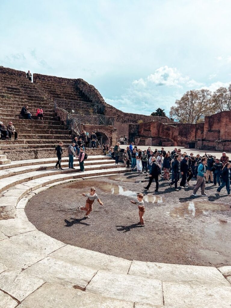 Children putting ont heir own show in the well preserved remains of Pompeii's Theatre District.