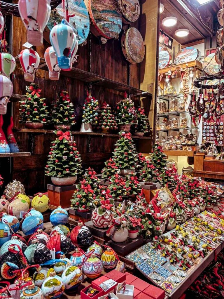 Christmas decorations on Via San Gregorio Armeno, a fun street to explore in Naples with kids.
