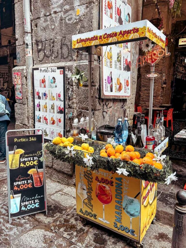 Aperol Spritz to go on the vibrant Via dei Tribunali in Naples