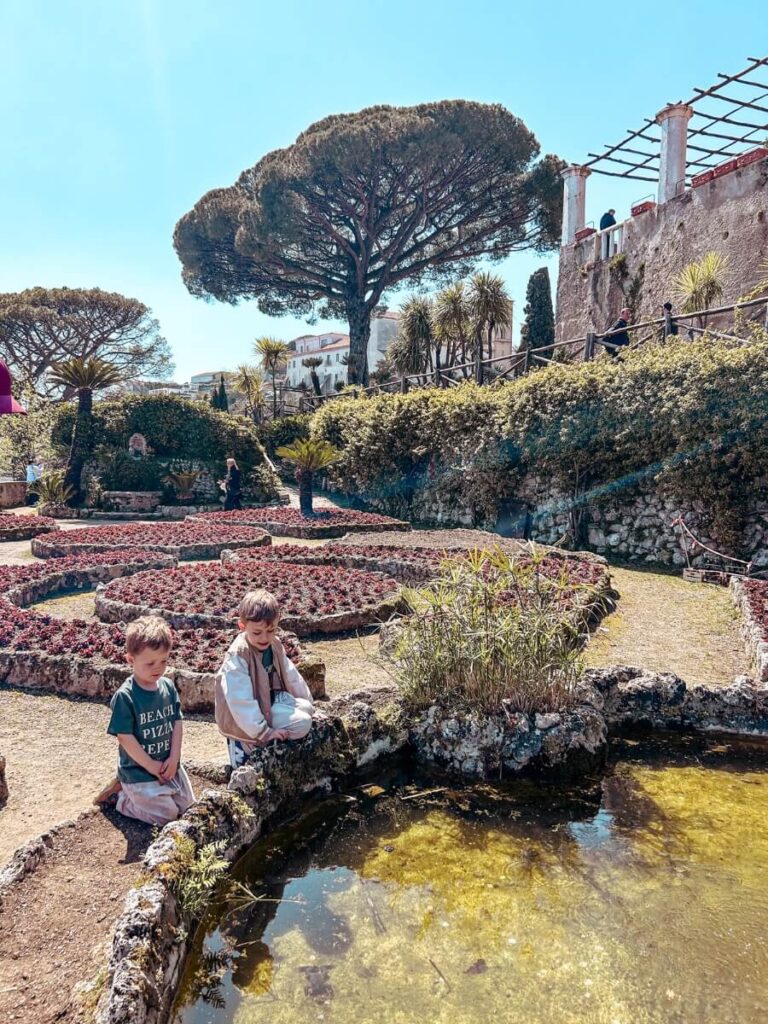 Children enjoying the gardens at Villa Rufolo. A fun place to visit in Ravello with kids.