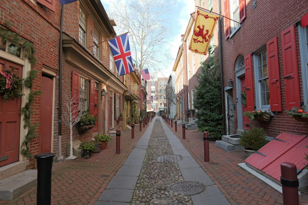 Elfreth's Alley in Philadelphia, a charming red brick street and must visit photo spot. 