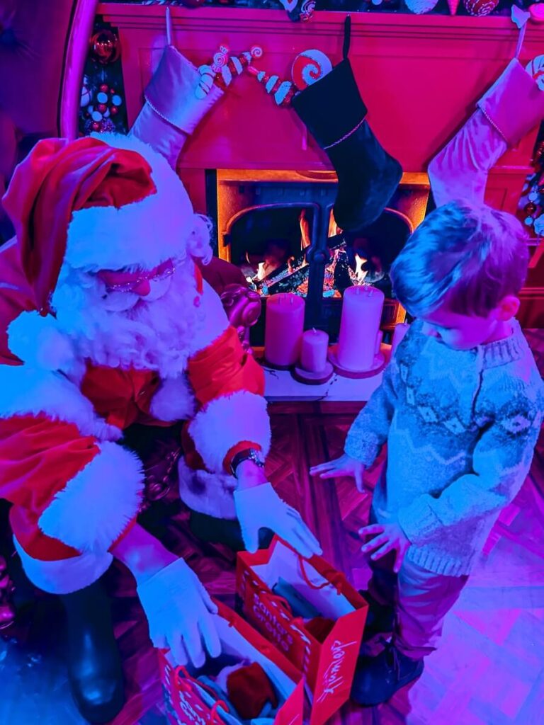 Child meeting Santa at Hamleys London.